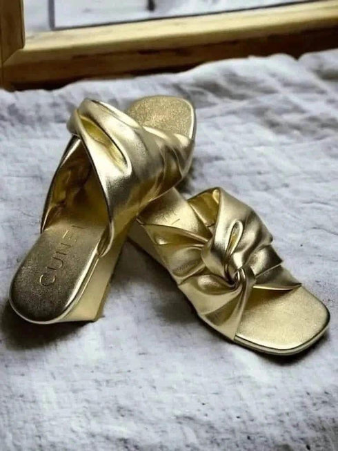 Wrapped in Gold Wedges - cunei
